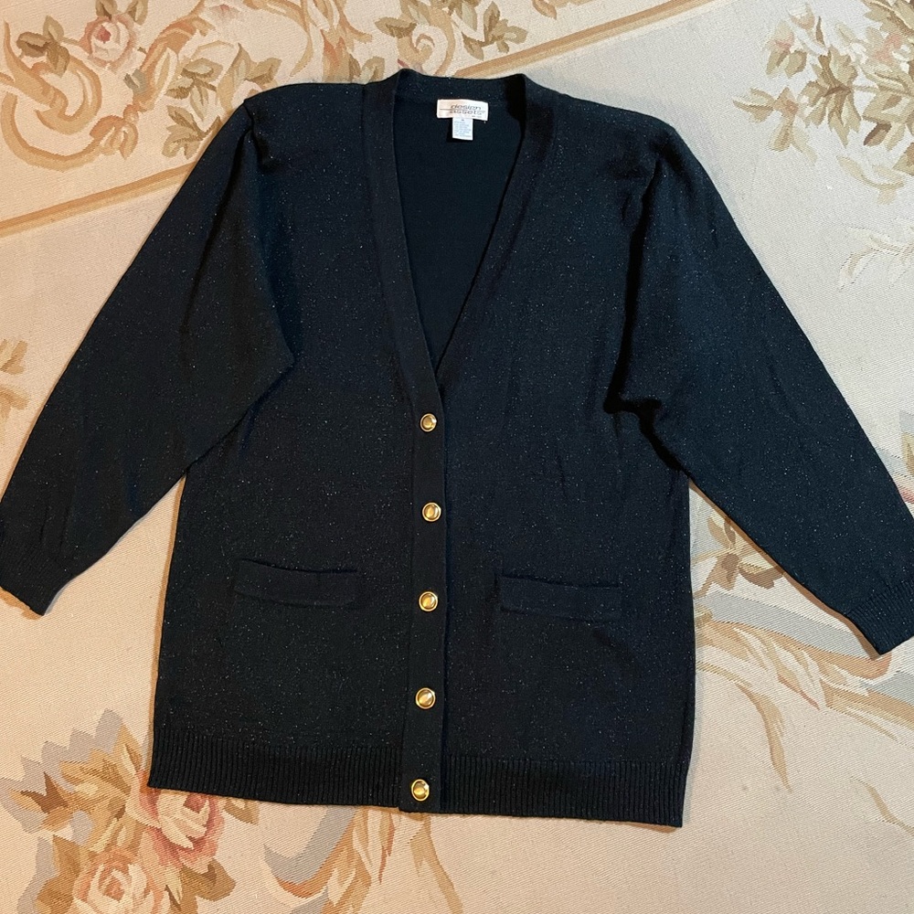 Black wool cardigan with subtle metallic sparkle in a generous medium
